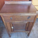 Early C20th oak bedside cupboard with single drawer over cupboard, H82cm