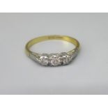 18ct yellow gold three stone diamond ring, the diamonds in illusion settings, stamped 750, O1/2, 2.