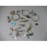 Collection of silver jewellery including an articulated fish pendant, two bamboo form bangles, a