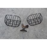 Pair of ornamental hayracks, approx W59cm D28cm and a quality cast painted flat back doorstop in the