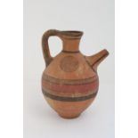 Cypriot Cypro-Archaic period terracotta spouted jug, black border with red central band and