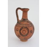Cypriot Cypro-Archaic period terracotta juglet, black border with concentric circle decoration,