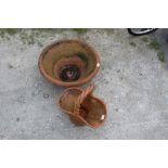 Large terracotta circular planter approx 59cm x 26cm and a terracotta planter in the shape of a