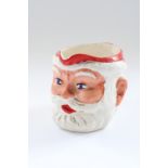 Tim Vincent collection - Mid C20th pottery Jolly Santa Christmas jug, H11cm