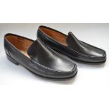 A pair of Loake Lifestyle calf leather men's flexible moccasin Treviso black shoes with leather