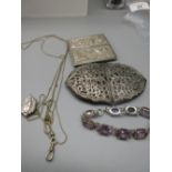 Sterling silver bracelet set with purple stones, stamped Sterling, L18.5cm, a white metal locket,
