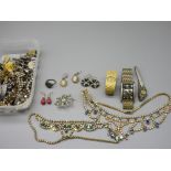 Collection of costume jewellery including brooches, earrings, watches etc.