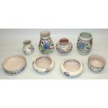 Collection of mid C20th Poole Pottery with painted decoration including four vases, max. H14cm, rose