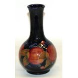 Moorcroft Pomegranate bottle shaped vase, blue ground, H24cm, with two drilled holes, previously