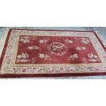 Chinese rug decorated with flower vases on a Salmon ground, 200cm x 130cm