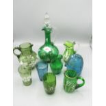 Late Victorian green glass decanter with clear stopper decorated with floral sprays H30cm and a