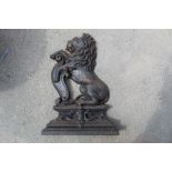 Cast iron flat back doorstop in the shape of a lion with shield H38cm