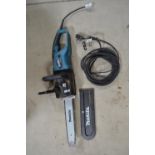 Corded Makita UC3551A chain saw with extension cable