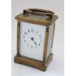 C20th French brass cased carriage clock timepiece, white enamel dial (lacking minute hand) visible