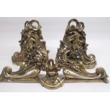 Anthea Turner Collection - C20th brass rococo style 3 section fender, adorned with cherubs holding