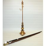 Novelty sectional walking cane, brass handle with compass and glass tube, an ebonised walking cane