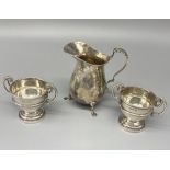 Hallmarked Sterling silver cream jug on paw feet with applied leaf handle, H8cm, and a pair of small