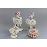 Early C20th Potschappel porcelain Dresden lace dancer figurines and a similar German seated