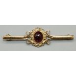 9ct yellow gold brooch set with oval cabochon cut amethyst in ornate mount, stamped 375, L5cm, 2.6g