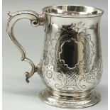 George III hallmarked silver mug, baluster body decorated with foliage scrolls and vacant cartouche,