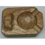 Robert Mouseman Thompson of Kilburn - an oak canted rectangular ashtray, carved with signature