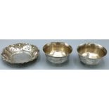 Pair of C20th Chinese silver circular bowls, decorated with character marks and foliage and birds,