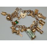9ct yellow gold chain link charm bracelet with heart padlock clasp and safety chain, set with