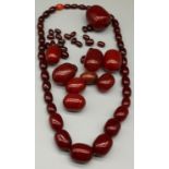 Loose cherry amber / bakelite beads of various sizes, largest 4.5ccm x 3.5cm and a cherry amber /