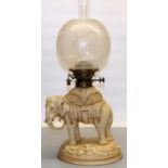 Victorian porcelain elephant oil lamp by Alfred Stellmacher, with Hinks Duplex brass fitting,