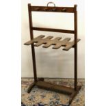 Early C20th whip and boot rack, for eight boots, mahogany frame with brass handle, W53cm D35cm