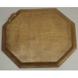 Robert Mouseman Thompson of Kilburn - an oak elongated octagonal bread board, carved with