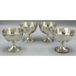 Set of four George V - Edward VIII hallmarked silver goblets by on stepped square bases, by Robert