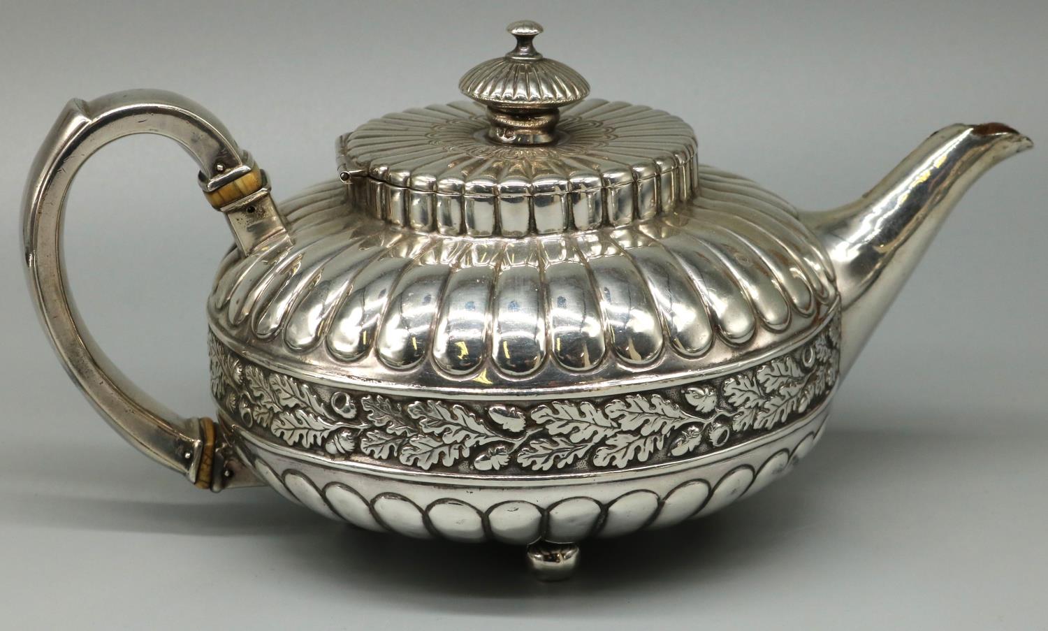George IV hallmarked silver three piece tea service, compressed lobed circular bodies with an oak - Image 2 of 6