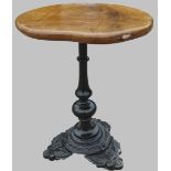 Robert Mouseman Thompson of Kilburn - a bar table, oval figured oak top on slender cast iron