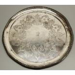 Early C20th Chinese silver circular tray, decorated to centre with scrolls and foliage around a