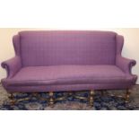 Queen Anne style sofa with wing back and outsplayed arms, on gilt angular S-scroll legs with bun