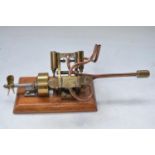 Charming scratch built all metal steam powered marine engine model, no boiler, on wood base. W26cm