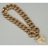 9ct yellow gold curb link charm bracelet, the links with engraved detail, with heart padlock clasp