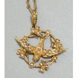 18ct yellow gold Edwardian swallow pendant set with seed pearls, stamped 18k with worn hallmarks, on