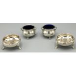 Pair of Victorian hallmarked silver cauldron salts with angular handles and blue glass liners on