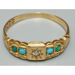 18ct yellow gold diamond and turquoise ring, the central star set diamond flanked by turquoise, on