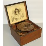 Victorian walnut cased Symphonion disc music box, paper label to the inside of the box, W25.8cm