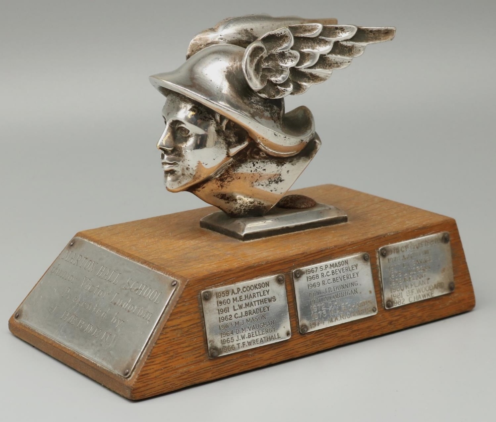 C20th chromed cast metal head of Hermes, mounted on an oak plinth as a trophy for 'Marton Hall