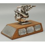 C20th chromed cast metal head of Hermes, mounted on an oak plinth as a trophy for 'Marton Hall