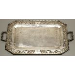 Early C20th Chinese hammered silver canted rectangular tray, border relief decorated with dragons