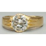 18ct yellow gold solitaire ring, the brilliant cut diamond in claw setting, on grooved shoulders and