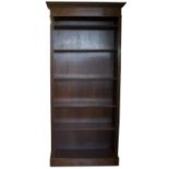 George III style mahogany open bookcase, stepped moulded cornice with ribbon tied swag frieze,