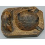 Robert Mouseman Thompson of Kilburn - an oak canted rectangular ashtray, carved with signature