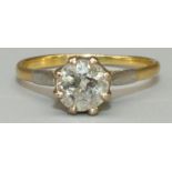 Yellow and white metal diamond solitaire ring, the round cut diamond in claw setting on taped