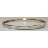 9ct yellow gold bangle set with brilliant cut diamonds, with box clasp closure, stamped 375, 12.3g